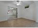 This is a sunroom with a ceiling fan and ceramic tile flooring at 409 Westwood Dr, Leesburg, FL 34748