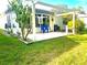 The cozy back patio includes an awning and outdoor seating, perfect for relaxation at 409 Westwood Dr, Leesburg, FL 34748