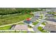Aerial view of a home located in a community, near a highway and a screened-in pool at 4157 Tiedemann Loop, The Villages, FL 32163