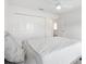 Bright bedroom featuring white walls, a large closet, plush carpet, and a ceiling fan at 4157 Tiedemann Loop, The Villages, FL 32163