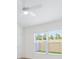 Vaulted bedroom featuring a ceiling fan and bright windows at 4157 Tiedemann Loop, The Villages, FL 32163