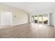 Bright, open living room with sliding glass doors leading to the patio, perfect for entertaining at 4157 Tiedemann Loop, The Villages, FL 32163