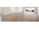 Spacious living area with wood flooring, patio doors, and natural light, creating an inviting and airy atmosphere at 4157 Tiedemann Loop, The Villages, FL 32163