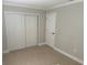 Bright bedroom with tiled floor, closet, and painted wainscoting detail for an elegant touch at 460 Wisteria Ave, Umatilla, FL 32784