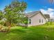 This backyard boasts a lush lawn and mature trees, offering a serene outdoor escape at 4800 Tara View Rd, Leesburg, FL 34748