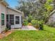 The backyard showcases a private lanai with lush greenery, ideal for relaxation and outdoor enjoyment at 4800 Tara View Rd, Leesburg, FL 34748
