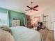 Spacious bedroom with a ceiling fan, dresser, and ample natural light at 4800 Tara View Rd, Leesburg, FL 34748