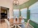 Charming breakfast nook with bright windows and stylish lighting at 4800 Tara View Rd, Leesburg, FL 34748
