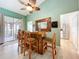 Charming bar area featuring wood finishes, stylish seating, and a view to the lanai at 4800 Tara View Rd, Leesburg, FL 34748