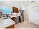 Bright kitchen with stainless steel appliances, wood cabinets and sleek countertops at 4800 Tara View Rd, Leesburg, FL 34748