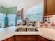 Stainless steel kitchen sink with white countertops and beautiful tile backsplash at 4800 Tara View Rd, Leesburg, FL 34748