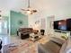 Spacious living room featuring leather furniture, neutral walls, and stylish decor at 4800 Tara View Rd, Leesburg, FL 34748