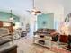 Bright living room with comfortable leather furniture, high ceilings, and modern decor at 4800 Tara View Rd, Leesburg, FL 34748