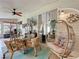 Outdoor patio featuring comfortable seating and a relaxing hanging chair at 4800 Tara View Rd, Leesburg, FL 34748