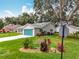 Landscaped yard with a well-maintained home, vibrant plantings, and corner street location at 4800 Tara View Rd, Leesburg, FL 34748