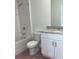Clean bathroom featuring a tub, toilet, vanity, and tile floors at 4957 Kaia Ave, Winter Haven, FL 33884