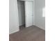 This bedroom has neutral carpeting and a closet with a sliding door for easy access at 4957 Kaia Ave, Winter Haven, FL 33884