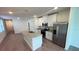 Modern kitchen with granite countertops, stainless steel appliances, and ample cabinet space at 4957 Kaia Ave, Winter Haven, FL 33884