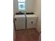 Practical laundry area with side-by-side washer and dryer, plus a window for natural light at 4957 Kaia Ave, Winter Haven, FL 33884