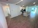 Spacious living area features tile floors, natural light, and seamless flow into the kitchen at 4957 Kaia Ave, Winter Haven, FL 33884