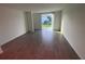 Inviting living area with tile flooring and sliding glass doors leading to the patio at 4957 Kaia Ave, Winter Haven, FL 33884