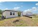 Backyard view with new construction homes and well-maintained landscaping at 4973 Kaia Ave, Winter Haven, FL 33884