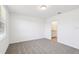 Bedroom with plush carpeting and a door to the bathroom at 4973 Kaia Ave, Winter Haven, FL 33884