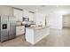 Modern kitchen features stainless steel appliances, granite countertops, and a spacious island at 4973 Kaia Ave, Winter Haven, FL 33884