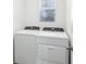 Laundry room featuring modern front-load washer and dryer units at 4973 Kaia Ave, Winter Haven, FL 33884