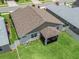 An aerial view of the property showing backyard, fence, and screened patio at 5019 Ne 125Th Loop, Oxford, FL 34484