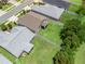 An aerial view of the property showing backyard, fence, and surrounding neighborhood at 5019 Ne 125Th Loop, Oxford, FL 34484