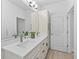 Bathroom with dual sinks, modern fixtures, and a bright and airy atmosphere at 5019 Ne 125Th Loop, Oxford, FL 34484