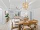 Open-concept living and dining area boasts abundant natural light, neutral tones, and modern finishes at 5019 Ne 125Th Loop, Oxford, FL 34484