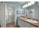 Bathroom features double sinks and a walk-in shower at 5068 Ne 121St Ave, Oxford, FL 34484