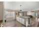Open concept kitchen with stone countertops and stainless steel appliances at 5068 Ne 121St Ave, Oxford, FL 34484
