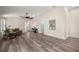 Open living room features vaulted ceilings and wood-look flooring throughout at 5068 Ne 121St Ave, Oxford, FL 34484