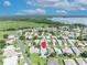 Aerial view of a residential area showing the property's location within the community near the lake, indicated by a red marker pin at 5964 Brittania Blvd, Tavares, FL 32778