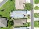 Aerial view highlights the home's layout, manicured lawn, and surrounding neighborhood in a great location at 5964 Brittania Blvd, Tavares, FL 32778