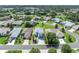 High-angle aerial highlights the house’s layout, lot, landscaping, and surrounding neighborhood in great location at 5964 Brittania Blvd, Tavares, FL 32778