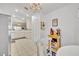 Open kitchen with white cabinets and appliances leading to the breakfast nook at 5964 Brittania Blvd, Tavares, FL 32778