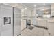 Bright kitchen featuring stainless steel appliances, tile flooring, and light cabinets at 5964 Brittania Blvd, Tavares, FL 32778