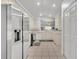 Bright kitchen featuring stainless steel appliances, and neutral colored cabinets at 5964 Brittania Blvd, Tavares, FL 32778