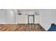 Living room kitchenette with white cabinetry, sink, microwave, and mini fridge at 5964 Brittania Blvd, Tavares, FL 32778