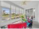 Inviting sunroom with scenic views and plenty of natural light at 5964 Brittania Blvd, Tavares, FL 32778