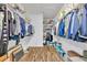 Spacious walk-in closet with shelving and vinyl floors at 5964 Brittania Blvd, Tavares, FL 32778