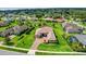 Aerial view showcases this home's location with mature landscaping and inviting curb appeal at 6008 Apex Way, Lady Lake, FL 32159