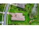 An aerial view of a well-maintained home with a brick driveway and manicured lawn at 6008 Apex Way, Lady Lake, FL 32159