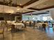 Elegant banquet hall with tables set for a formal event, featuring wood trim and neutral decor at 6008 Apex Way, Lady Lake, FL 32159