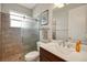 This bathroom features a walk-in shower with glass door and a vanity with white countertop at 6008 Apex Way, Lady Lake, FL 32159