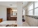 Bathroom with soaking tub, walk-in shower, and vanity with framed mirror at 6008 Apex Way, Lady Lake, FL 32159